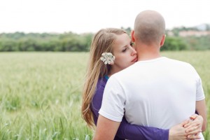 Loving couple standing in the field