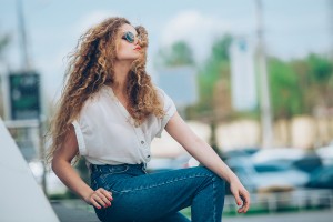 Beauty Girl Outdoors enjoying nature. Beautiful Teenage Model gi